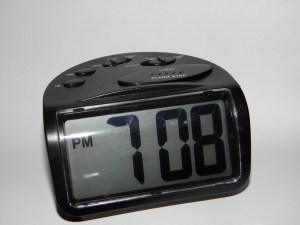 Digital clock reading 7:08 PM
