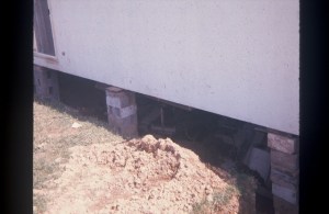 House braced up with bricks.