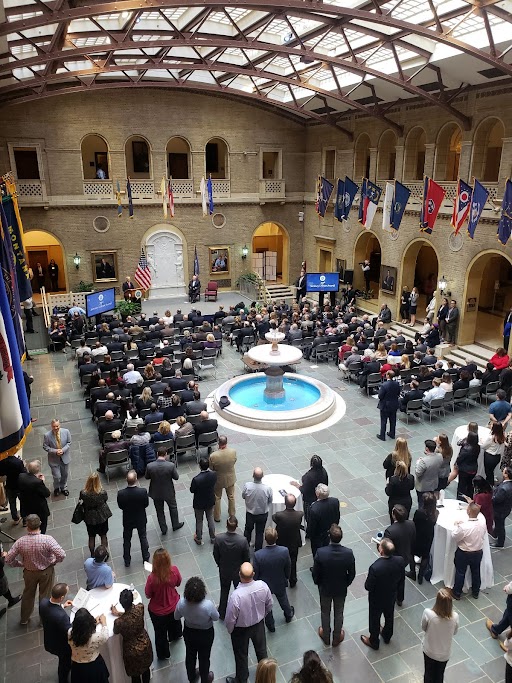 A large group of people gathered at the USDA's courtyard for speeches.
